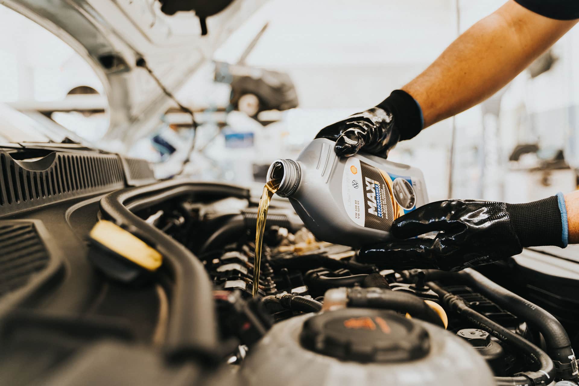 Engine oil being poured into an engine