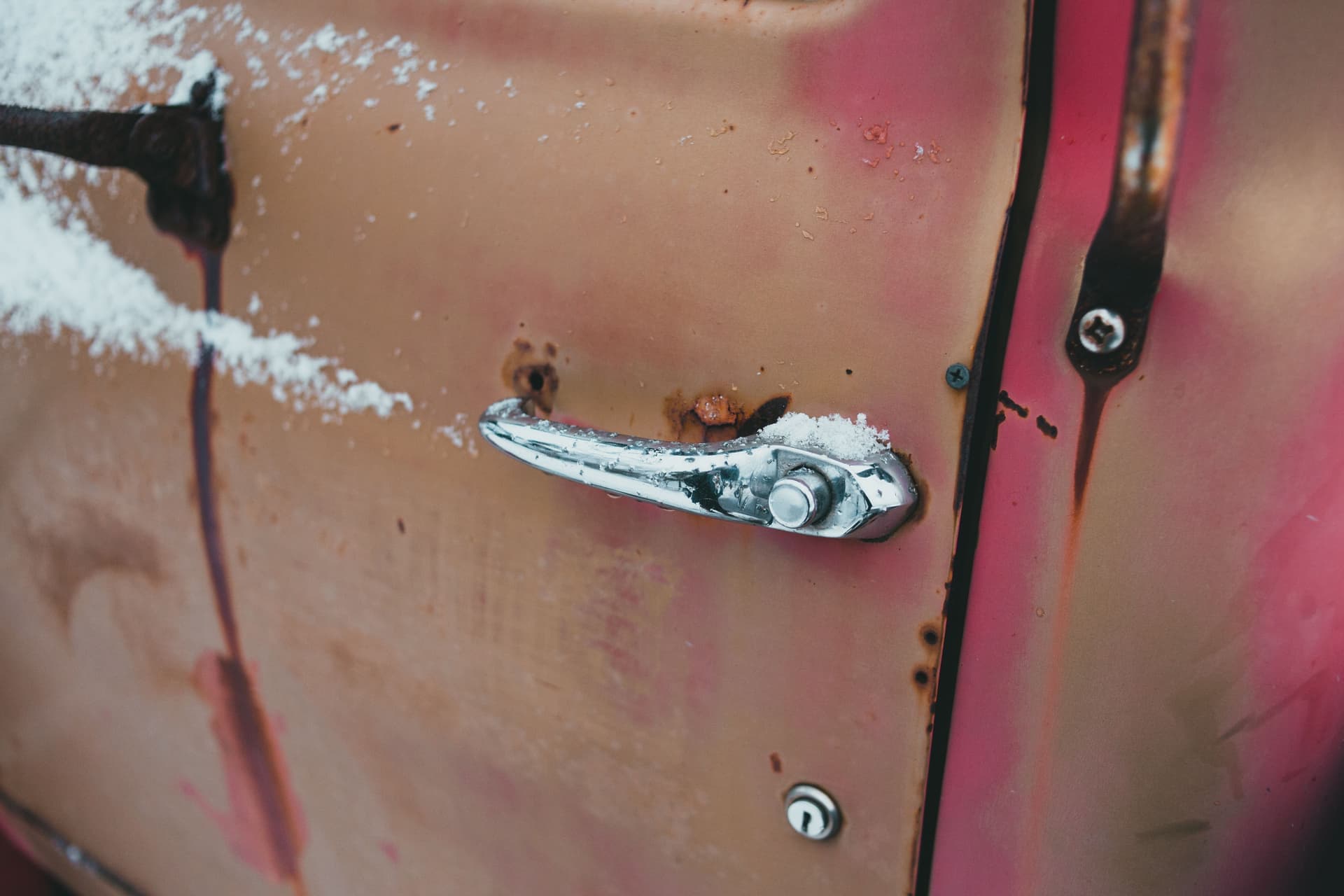 A car door and handle in freezing conditions