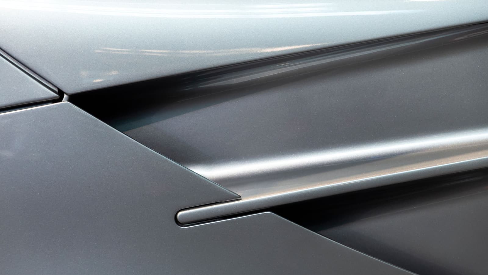 Close-up of a car body panel showing the paint surface