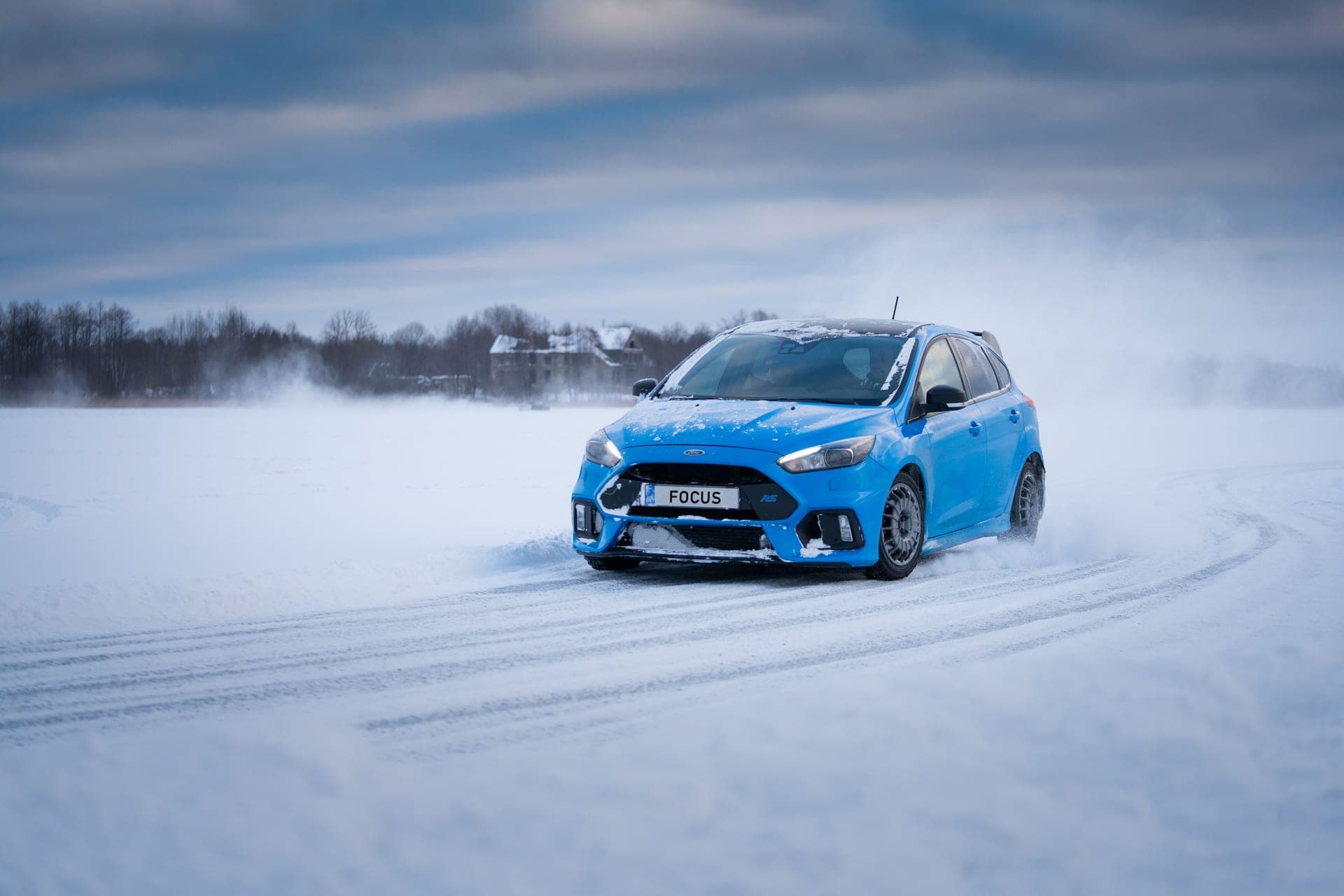 A car driving on a snow-covered road